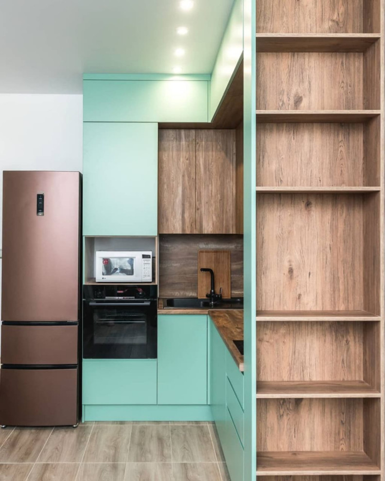 Маленькая угловая кухня мятного цвета для студии