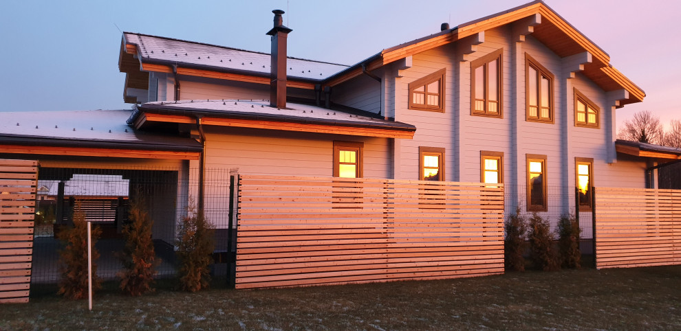 Дом из клееного бруса с навесом для машин 426 м.кв.