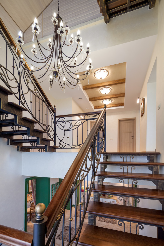 Двухэтажный дом с цокольным этажом и мансардой